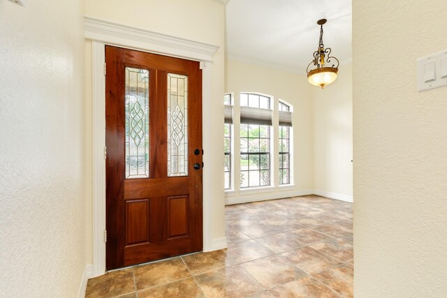 21 Alexander Ct, Angleton, TX 77515 - foyer entrance with a textured wall and tile patterned flooring