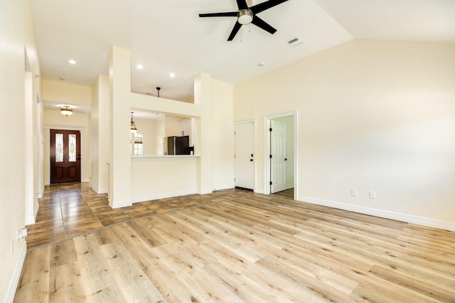 21 Alexander Ct, Angleton, TX 77515 - unfurnished living room featuring ceiling fan, light wood-type flooring, high vaulted ceiling, and recessed lighting