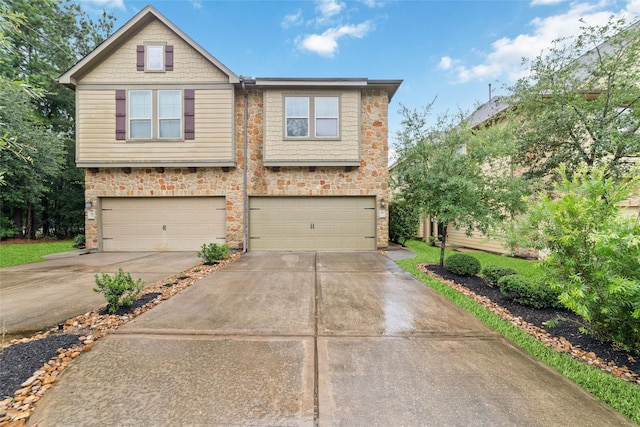 9 Cheswood Manor Dr, Spring, TX 77382 - craftsman house with concrete driveway, stone siding, and an attached garage