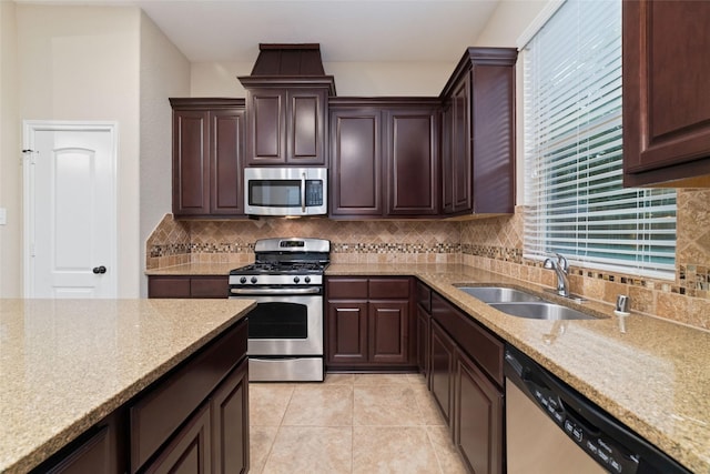 9 Cheswood Manor Dr, Spring, TX 77382 - kitchen featuring stainless steel appliances, backsplash, and healthy amount of natural light