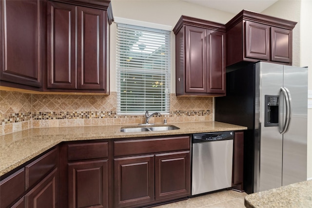 9 Cheswood Manor Dr, Spring, TX 77382 - kitchen featuring stainless steel appliances, backsplash, and light stone counters