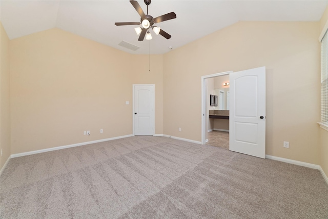 9 Cheswood Manor Dr, Spring, TX 77382 - unfurnished bedroom with vaulted ceiling, carpet, ensuite bathroom, and a ceiling fan