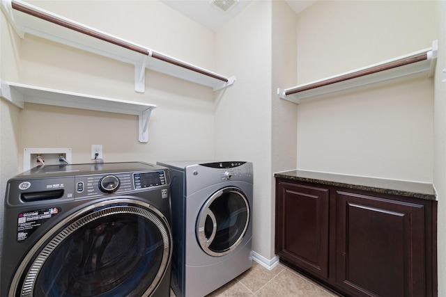 9 Cheswood Manor Dr, Spring, TX 77382 - washroom featuring washing machine and dryer, light tile patterned floors, and cabinet space