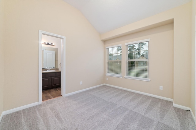 9 Cheswood Manor Dr, Spring, TX 77382 - unfurnished bedroom featuring light colored carpet, lofted ceiling, and ensuite bath