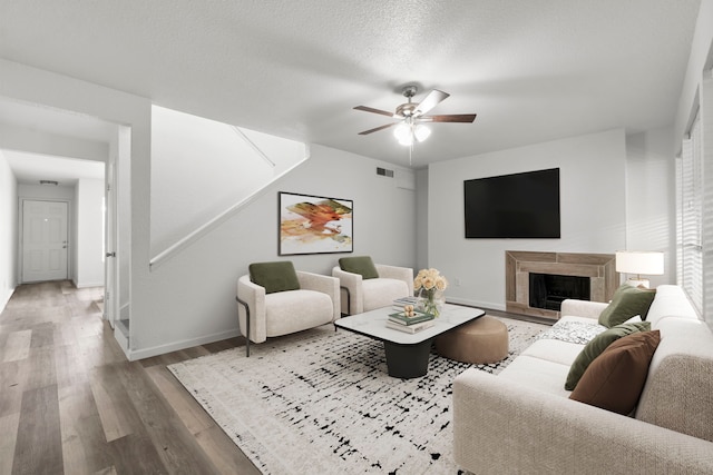 781 Country Place Dr Unit 2083, Houston, TX 77079 - living room with wood finished floors, ceiling fan, and a fireplace