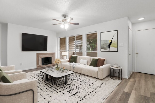 781 Country Place Dr Unit 2083, Houston, TX 77079 - living area featuring a ceiling fan, wood finished floors, and a premium fireplace