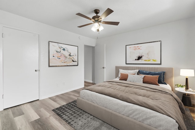 781 Country Place Dr Unit 2083, Houston, TX 77079 - bedroom featuring wood finished floors and ceiling fan