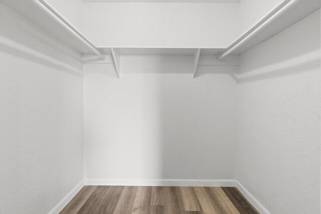 781 Country Place Dr Unit 2083, Houston, TX 77079 - walk in closet featuring dark wood-style floors
