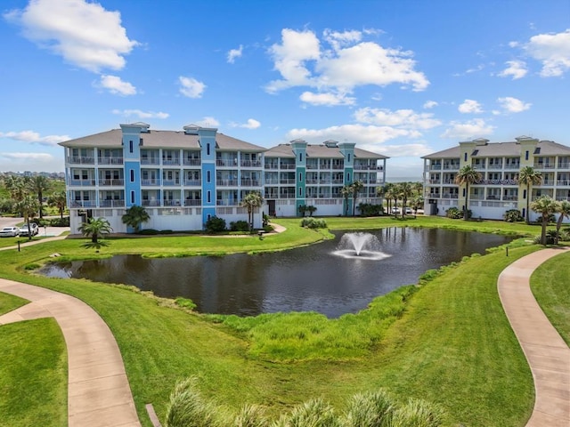 4121 Pointe W Dr Unit 103, Galveston, TX 77554 - view of community with a water view and a yard