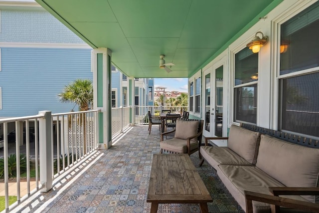 4121 Pointe W Dr Unit 103, Galveston, TX 77554 - balcony with ceiling fan and an outdoor hangout area
