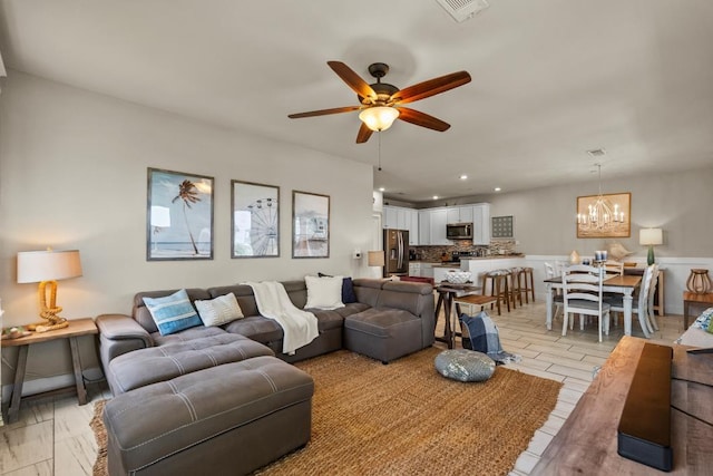 4121 Pointe W Dr Unit 103, Galveston, TX 77554 - living room with a ceiling fan, a chandelier, and recessed lighting