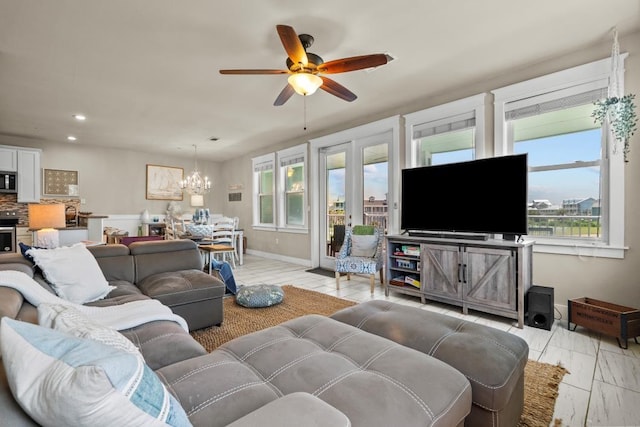 4121 Pointe W Dr Unit 103, Galveston, TX 77554 - living area featuring healthy amount of natural light, a chandelier, ceiling fan, and recessed lighting