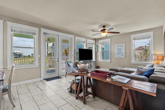 4121 Pointe W Dr Unit 103, Galveston, TX 77554 - living room featuring a ceiling fan