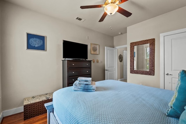 4121 Pointe W Dr Unit 103, Galveston, TX 77554 - bedroom with wood finished floors and a ceiling fan
