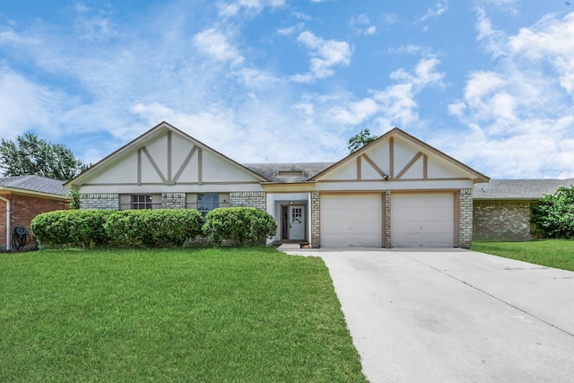 17715 Glenpatti Dr, Houston, TX 77084 - tudor house featuring a front yard, concrete driveway, an attached garage, and stucco siding