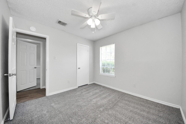 17715 Glenpatti Dr, Houston, TX 77084 - unfurnished bedroom with carpet, a textured ceiling, and a ceiling fan