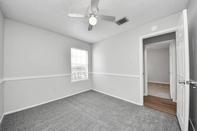 17715 Glenpatti Dr, Houston, TX 77084 - empty room featuring carpet, a textured ceiling, a ceiling fan, and a smoke detector
