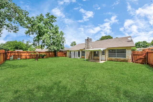 17715 Glenpatti Dr, Houston, TX 77084 - rear view of house featuring a fenced backyard, a chimney, a patio, and brick siding