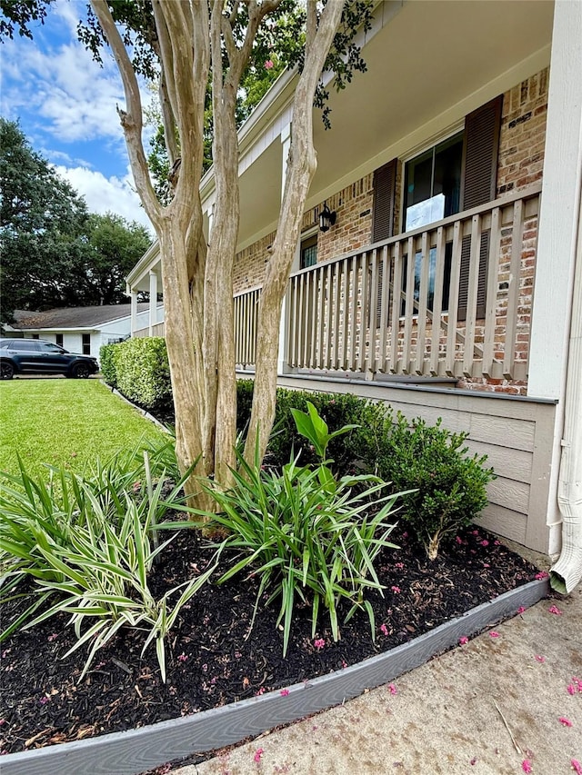 11418 Braewick Dr, Houston, TX 77035 - view of side of property featuring brick siding and a porch