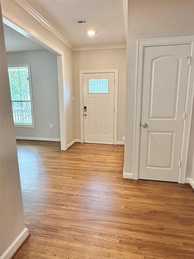11418 Braewick Dr, Houston, TX 77035 - entryway featuring ornamental molding and light wood-style floors