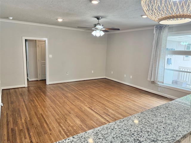 11418 Braewick Dr, Houston, TX 77035 - unfurnished room featuring crown molding, wood finished floors, a ceiling fan, and a textured ceiling