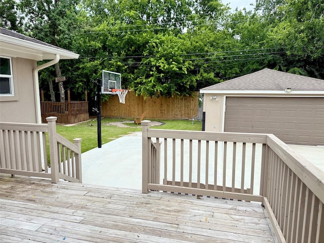 11418 Braewick Dr, Houston, TX 77035 - wooden deck featuring an outbuilding, a lawn, and a detached garage
