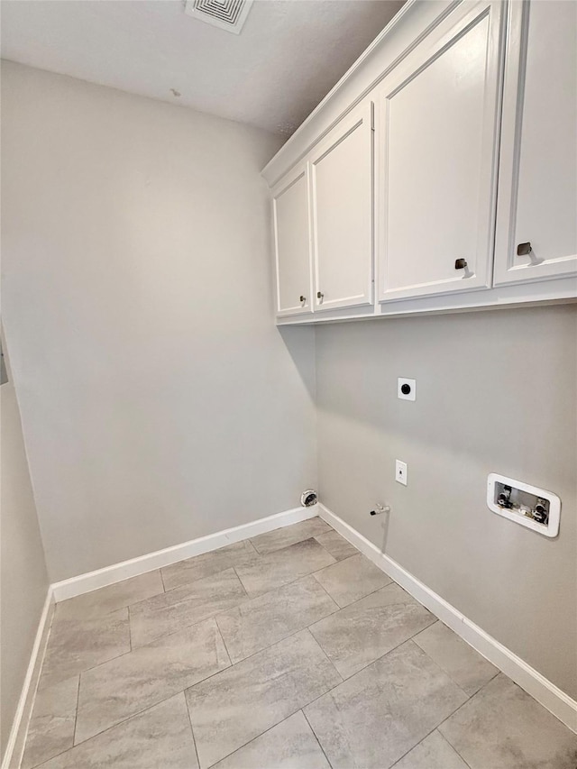 11418 Braewick Dr, Houston, TX 77035 - laundry room with hookup for an electric dryer, hookup for a washing machine, cabinet space, and gas dryer hookup