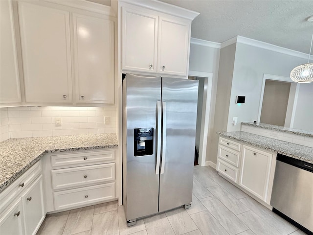 11418 Braewick Dr, Houston, TX 77035 - kitchen featuring appliances with stainless steel finishes, backsplash, white cabinetry, crown molding, and light stone counters