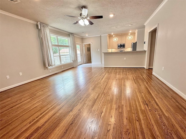 11418 Braewick Dr, Houston, TX 77035 - unfurnished living room with wood finished floors, crown molding, a ceiling fan, and a textured ceiling