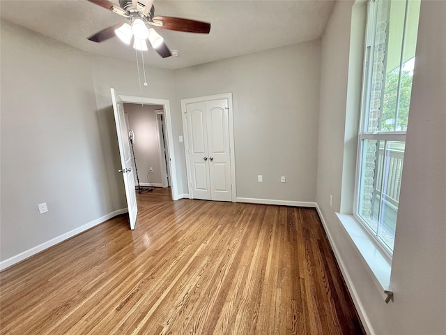 11418 Braewick Dr, Houston, TX 77035 - unfurnished bedroom featuring wood finished floors, a ceiling fan, and a closet