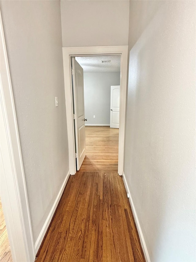 11418 Braewick Dr, Houston, TX 77035 - corridor with baseboards and wood finished floors