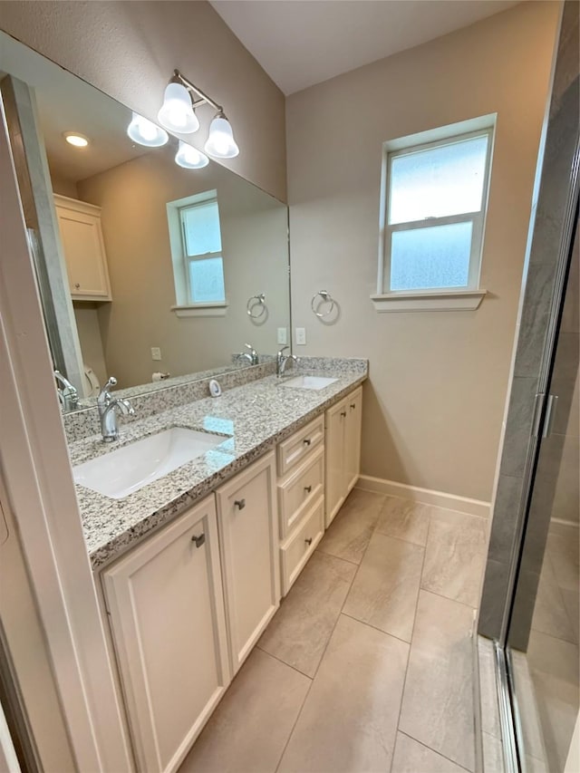 11418 Braewick Dr, Houston, TX 77035 - full bathroom with double vanity, a shower stall, and tile patterned flooring