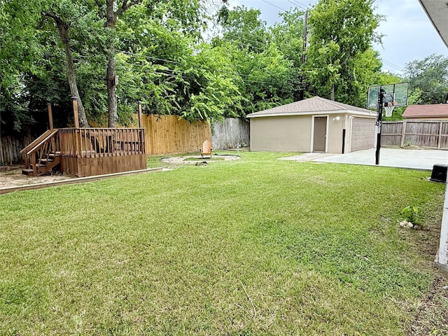 11418 Braewick Dr, Houston, TX 77035 - fenced backyard featuring an outbuilding, a garage, and a wooden deck