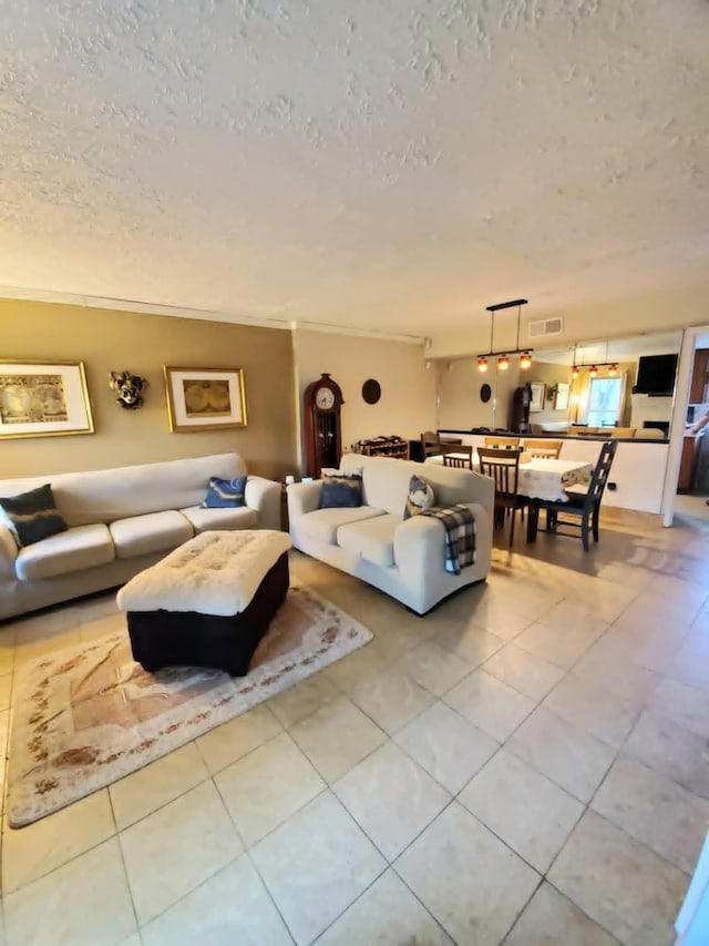 8728 Wilcrest Dr Unit 8728, Houston, TX 77099 - living room with a textured ceiling and tile patterned flooring
