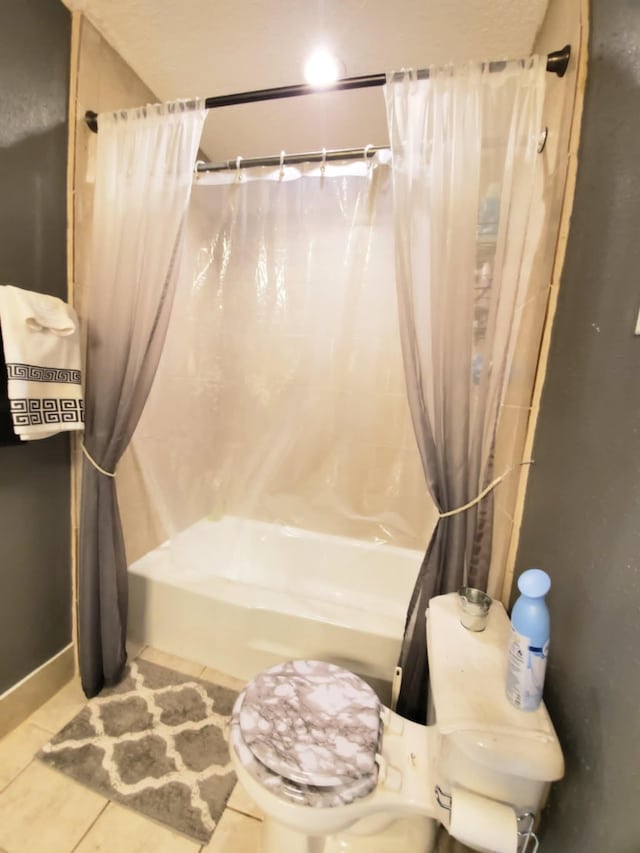 8728 Wilcrest Dr Unit 8728, Houston, TX 77099 - bathroom featuring tile patterned floors and shower / bath combo
