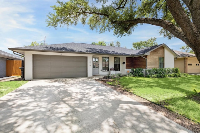 1810 Nauts Ct, Houston, TX 77008 - ranch-style home with a garage, driveway, a front yard, and stucco siding