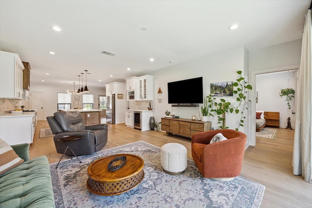 1810 Nauts Ct, Houston, TX 77008 - living area with light wood-style floors, beverage cooler, and recessed lighting