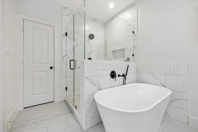 1810 Nauts Ct, Houston, TX 77008 - bathroom featuring a freestanding bath, a stall shower, tile walls, recessed lighting, and pet washing area