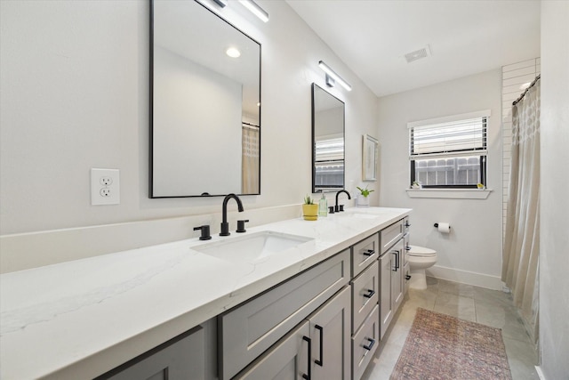 1810 Nauts Ct, Houston, TX 77008 - bathroom with double vanity, tile patterned floors, and a shower with shower curtain