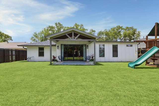 1810 Nauts Ct, Houston, TX 77008 - rear view of house featuring a playground, board and batten siding, a shingled roof, and a patio