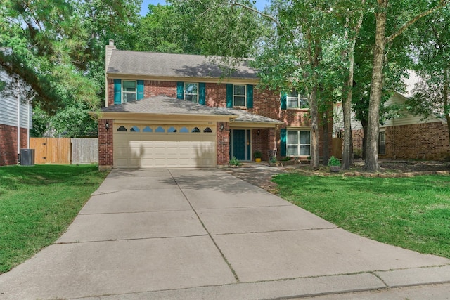 100 W Rainbow Ridge Cir, The Woodlands, TX 77381 - view of front of property featuring driveway, a garage, brick siding, and a chimney