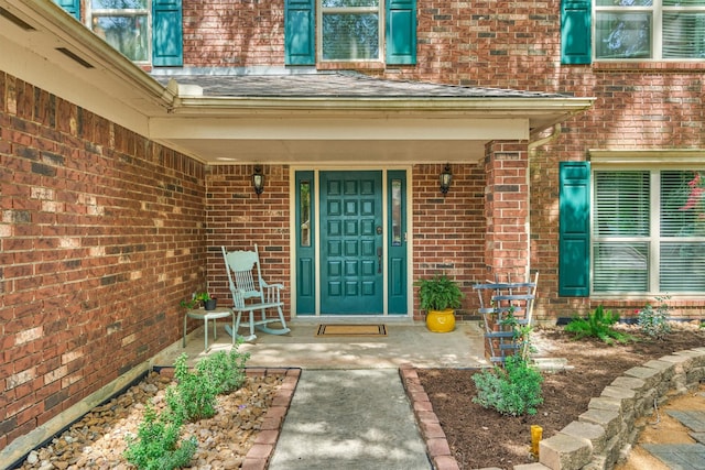100 W Rainbow Ridge Cir, The Woodlands, TX 77381 - view of exterior entry featuring brick siding and covered porch