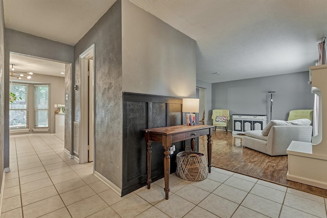100 W Rainbow Ridge Cir, The Woodlands, TX 77381 - living area featuring light tile patterned floors and baseboards