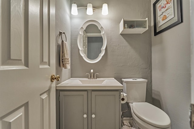 100 W Rainbow Ridge Cir, The Woodlands, TX 77381 - half bathroom featuring vanity and toilet