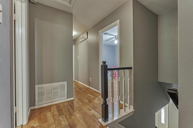 100 W Rainbow Ridge Cir, The Woodlands, TX 77381 - hall with an upstairs landing and wood finished floors