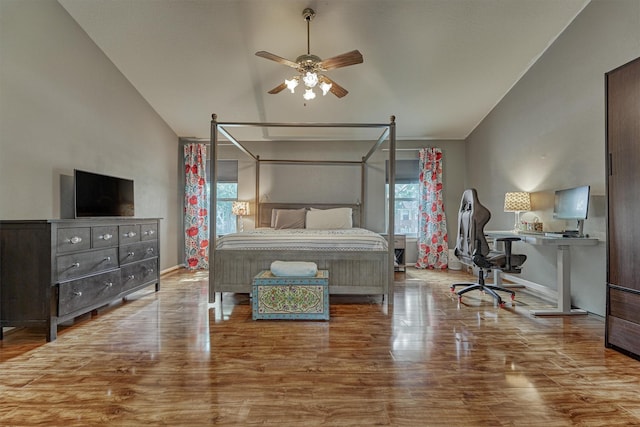100 W Rainbow Ridge Cir, The Woodlands, TX 77381 - bedroom featuring lofted ceiling, wood finished floors, an office area, and a ceiling fan