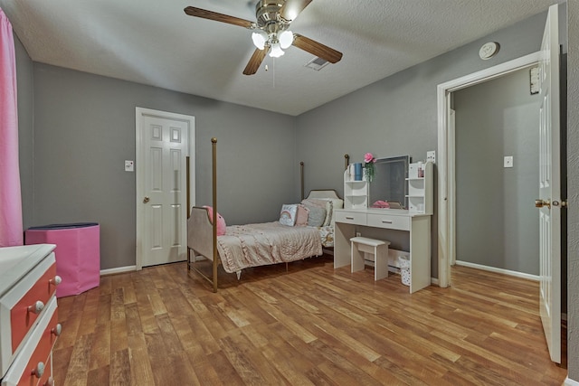 100 W Rainbow Ridge Cir, The Woodlands, TX 77381 - bedroom featuring wood finished floors and a ceiling fan