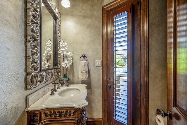 102 Lake Sterling Gate Dr, Spring, TX 77379 - bathroom featuring vanity and a textured wall