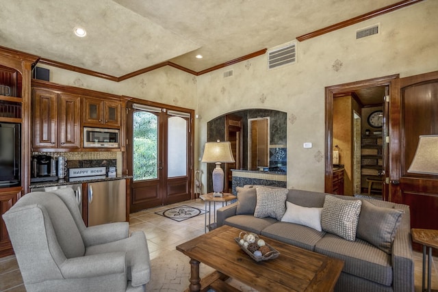 102 Lake Sterling Gate Dr, Spring, TX 77379 - living area with crown molding, arched walkways, recessed lighting, and a high ceiling