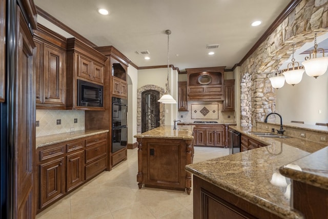 102 Lake Sterling Gate Dr, Spring, TX 77379 - kitchen with black appliances, tasteful backsplash, a center island with sink, recessed lighting, and decorative light fixtures